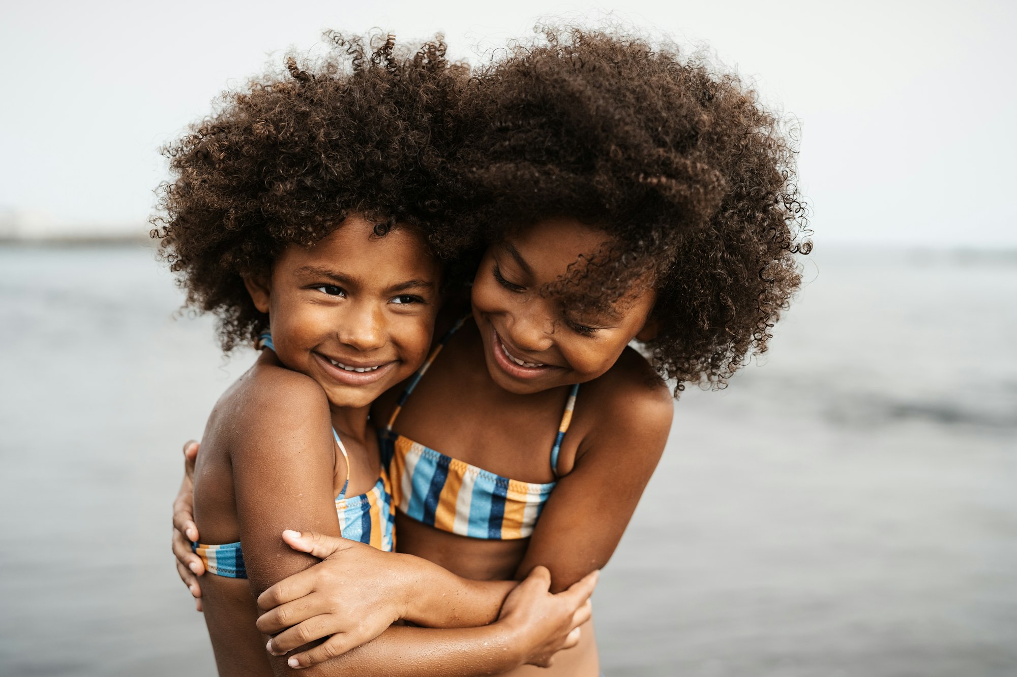 Happy African children having fun on the beach during summer holidays